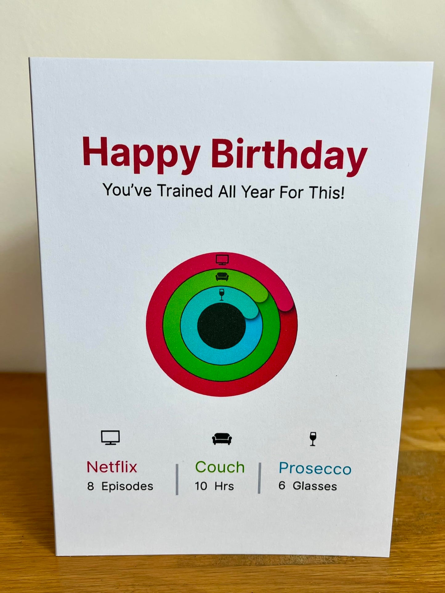 Funny Activity Ring (Prosecco, TV & Couch) Fitness Tracker Birthday Card. You've trained all year for this!